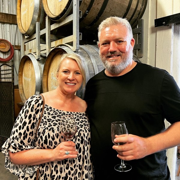 a person holding a wine glass