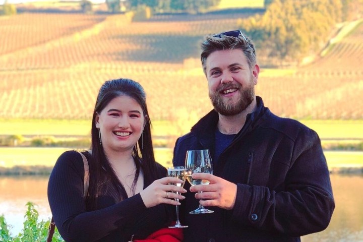 a man holding a glass of wine