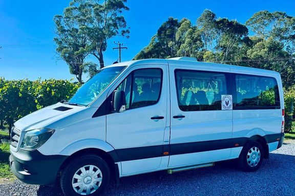 a van parked in front of a car
